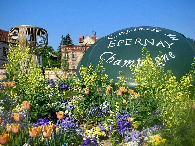 The Epernay Champagne sign in a bed of summer planting
